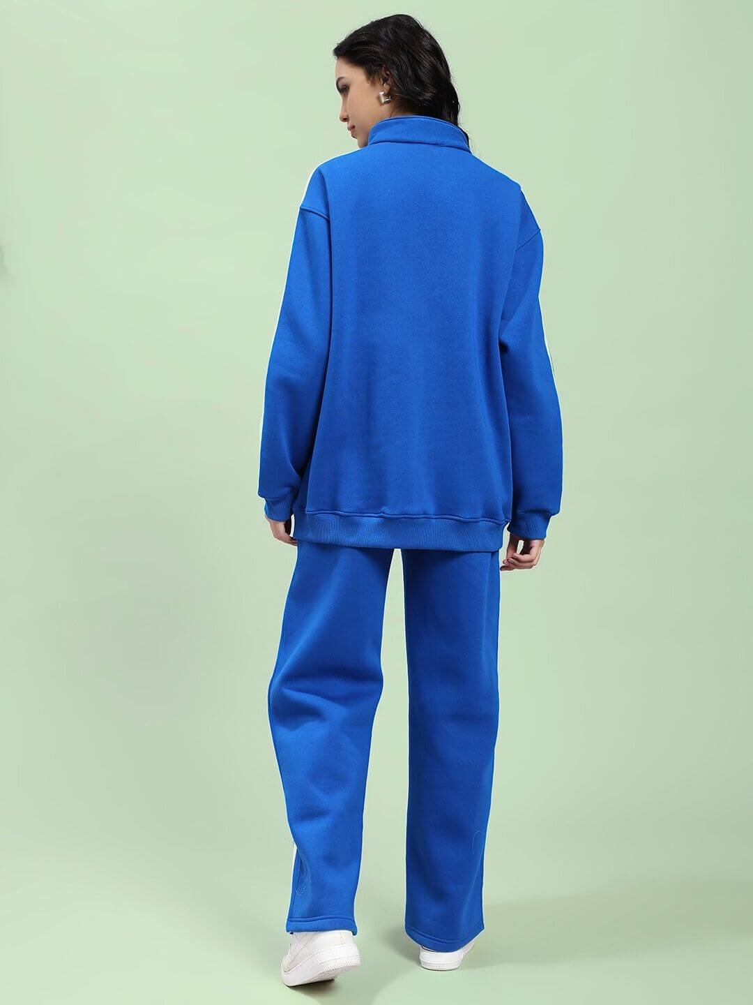 Back view of WOMEN RAPID STRIDE ROYAL BLUE COTTON FLEECE CO-ORD SET highlighting cozy, stylish design on model in neutral background.