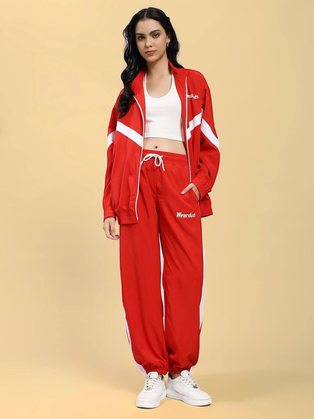 Model wearing WOMEN ROYAL COMFORT RELAXED FIT JACKET RED with matching red pants, showcasing effortless style and sophistication.