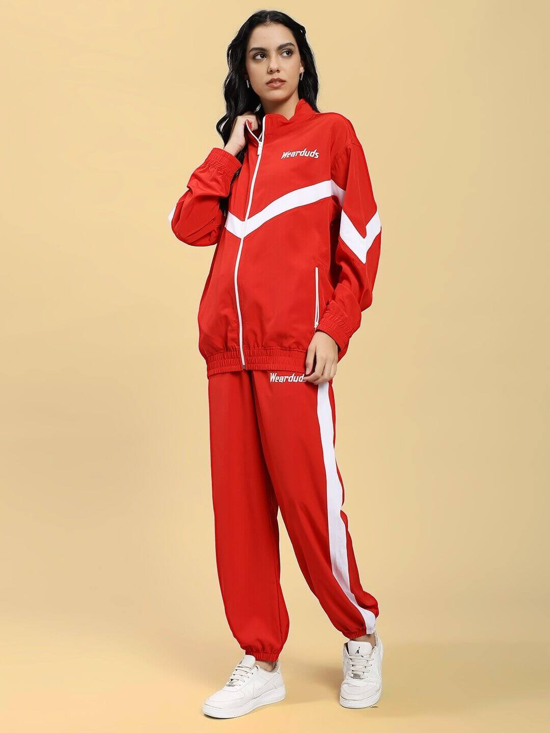 A model wearing the WOMEN ROYAL COMFORT RELAXED FIT CO-ORD SET RED, featuring a stylish and comfortable red matching set with white accents.