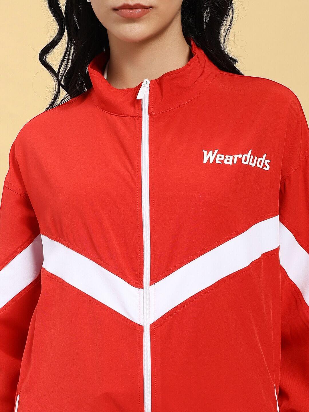 WOMEN ROYAL COMFORT RELAXED FIT JACKET RED with white stripes on model, showcasing the stylish and comfortable design.