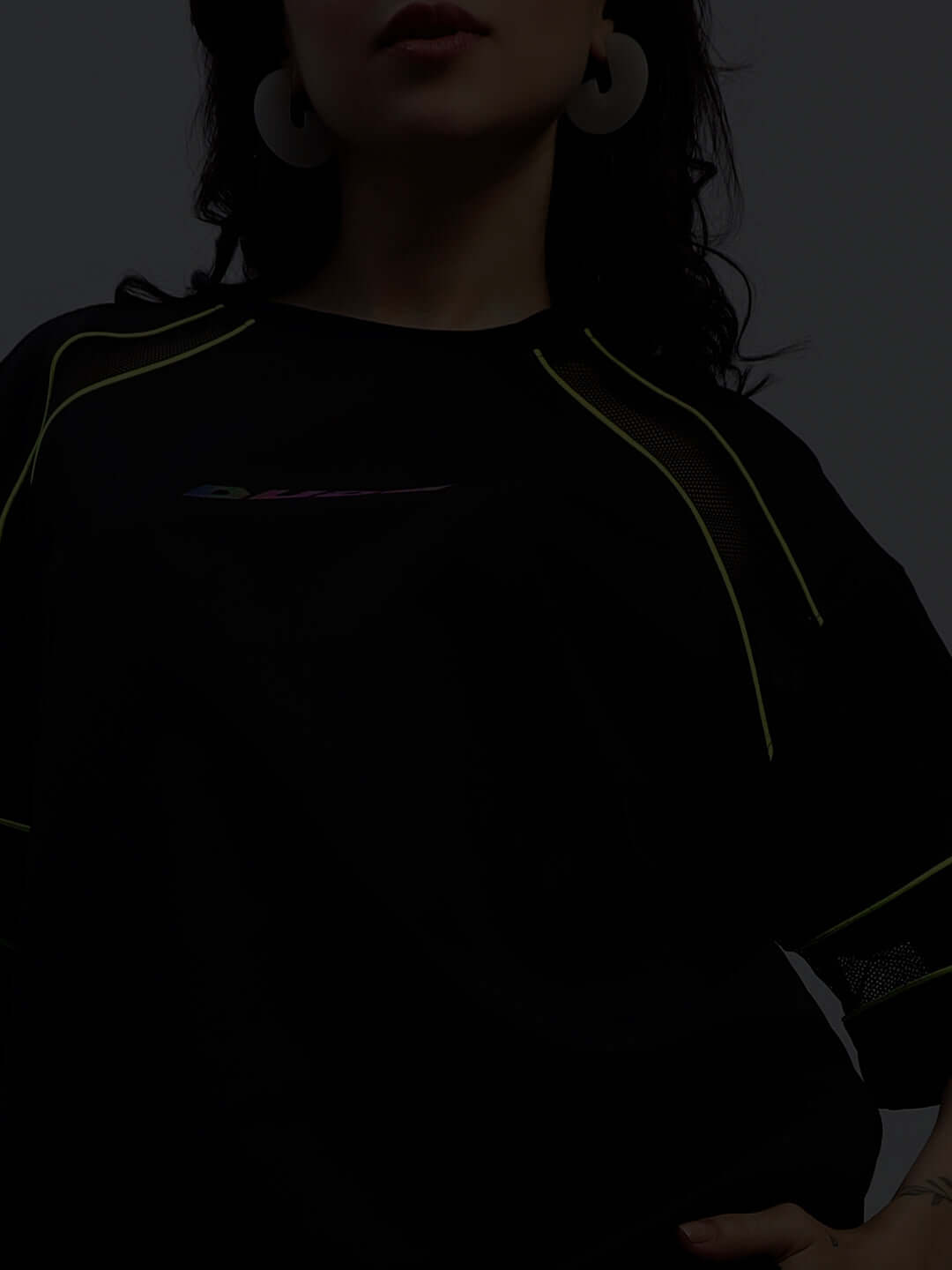 Model wearing Women's Salvo Reflector Co-Ord Set in black, made from premium sports polyester fabric. Ideal for stylish and active wear.