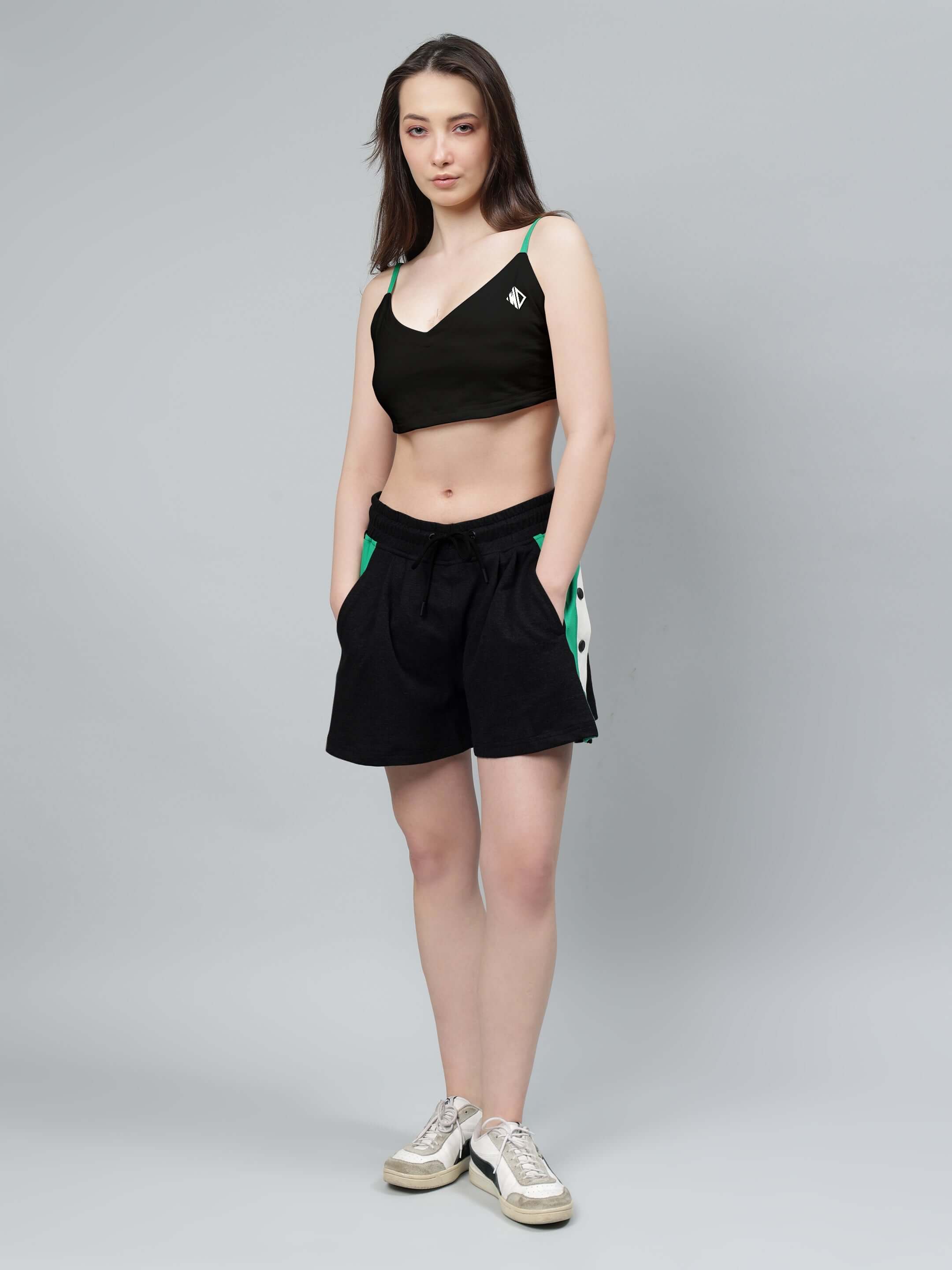 Model wearing WOMEN'S SAMMIE CO-ORD SET BLACK featuring a stylish crop top and shorts, perfect for versatile and comfortable all-day wear.