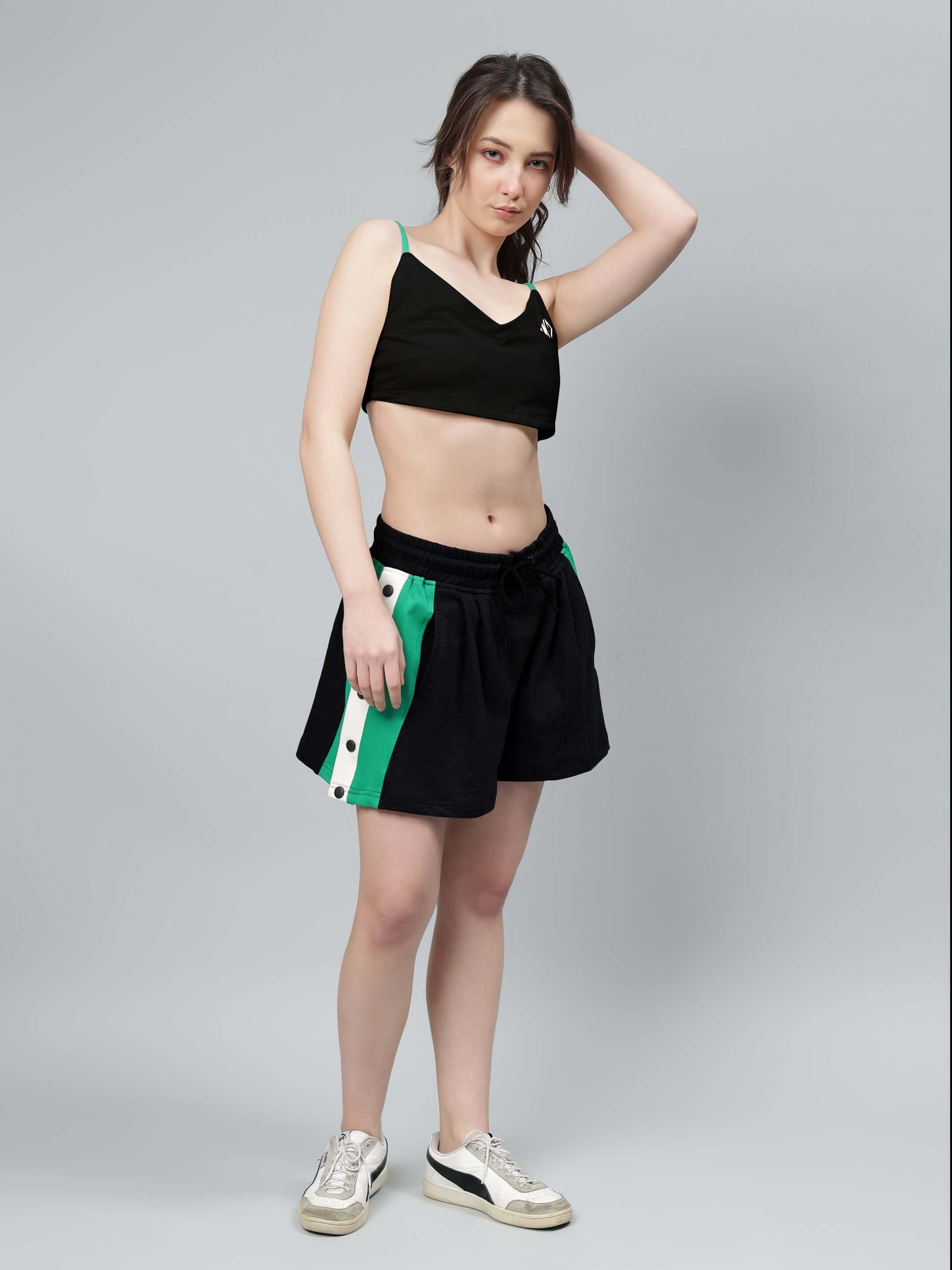Woman wearing WOMEN'S SAMMIE CO-ORD SET BLACK showing modern fashion.