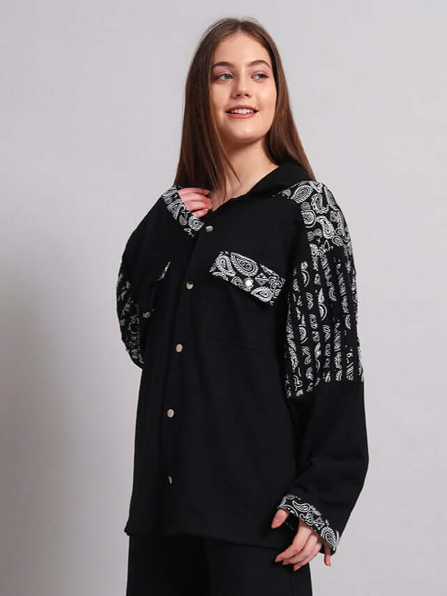 Alt Tag: Model wearing a black Sanganeri shirt by DUDS with patterned sleeves, highlighting traditional craftsmanship and custom fit options.