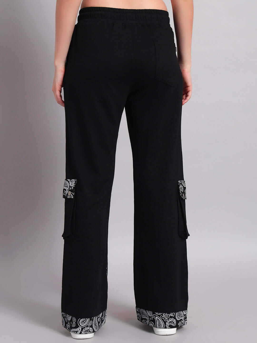 Back view of women's Sanganeri joggers in black featuring paisley accents, designed for comfort and style, made by DUDS.