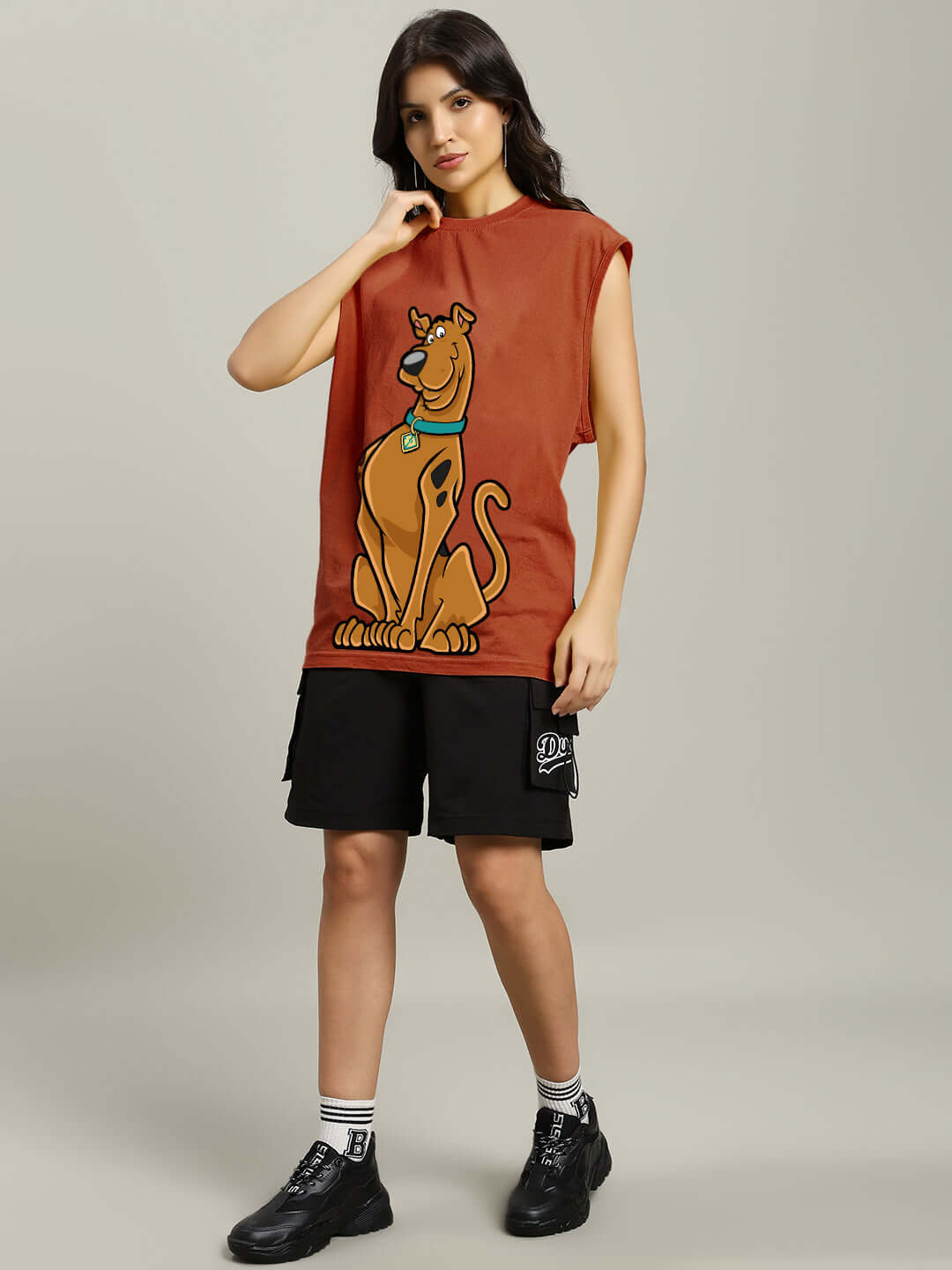 Women's Scooby Gym T-shirt in brown with custom fit option, shown on a model, featuring a bold Scooby-Doo graphic.