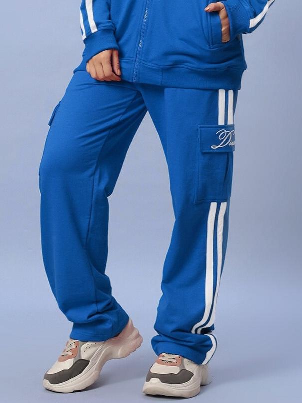 Royal blue striped joggers for women, showcasing DUDS' tailored craftsmanship, perfect for casual wear and available in custom fit options.