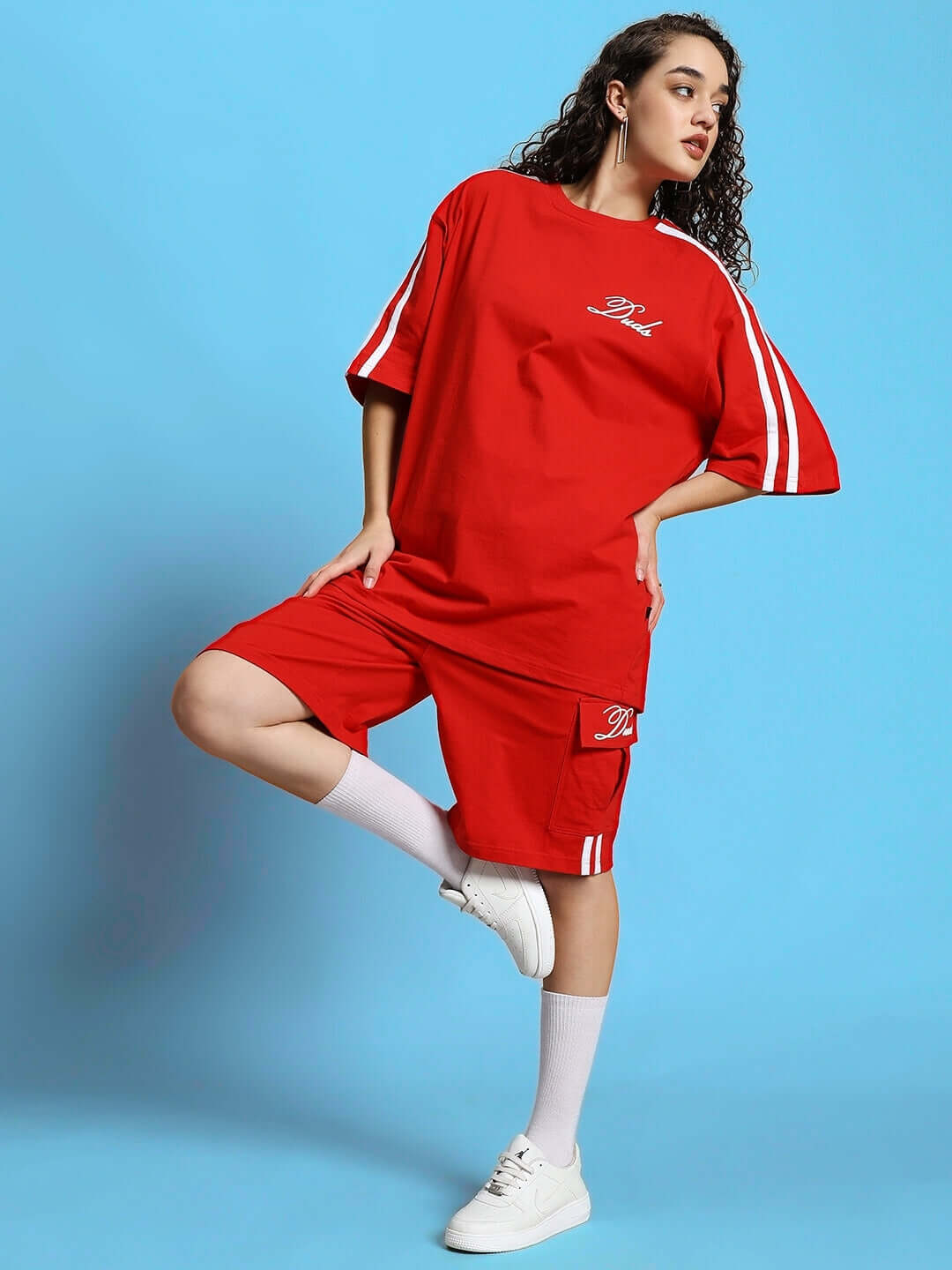 Woman wearing WOMEN'S SCOTIA SUMMER CO-ORD SET RED, featuring a stylish red top and shorts, perfect for summer fashion.
