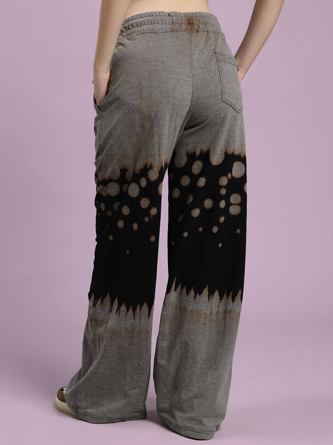 Back view of WOMEN SHADOW SWIRL TIE-DYE JOGGER BLACK highlighting unique design and style.