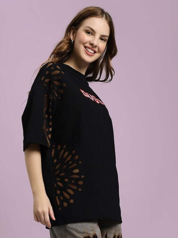 Woman wearing WOMEN'S SHADOW SWIRL TIE-DYE T-SHIRT BLACK with unique shadow swirl design, perfect for casual outfits.