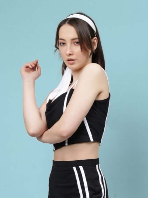 Woman wearing WOMEN'S SIMONE CROP-TOP - BLACK, stylish and versatile