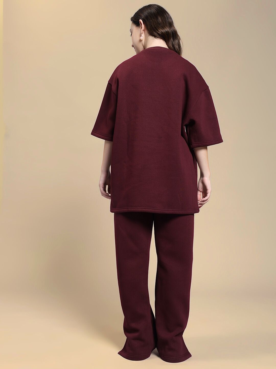 Back view of model in WOMEN SKODA FLEECE CO-ORD SET MAROON, showcasing trendy and comfortable style for women.