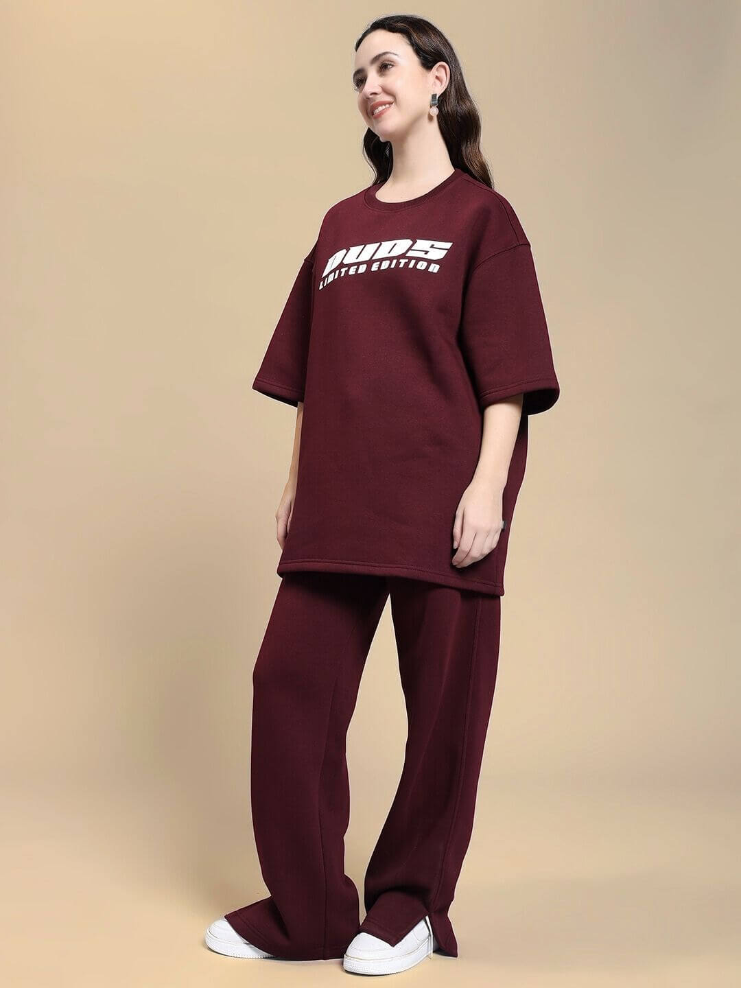 Woman wearing WOMEN SKODA FLEECE CO-ORD SET MAROON, showcasing trendy and comfortable maroon fashion outfit.