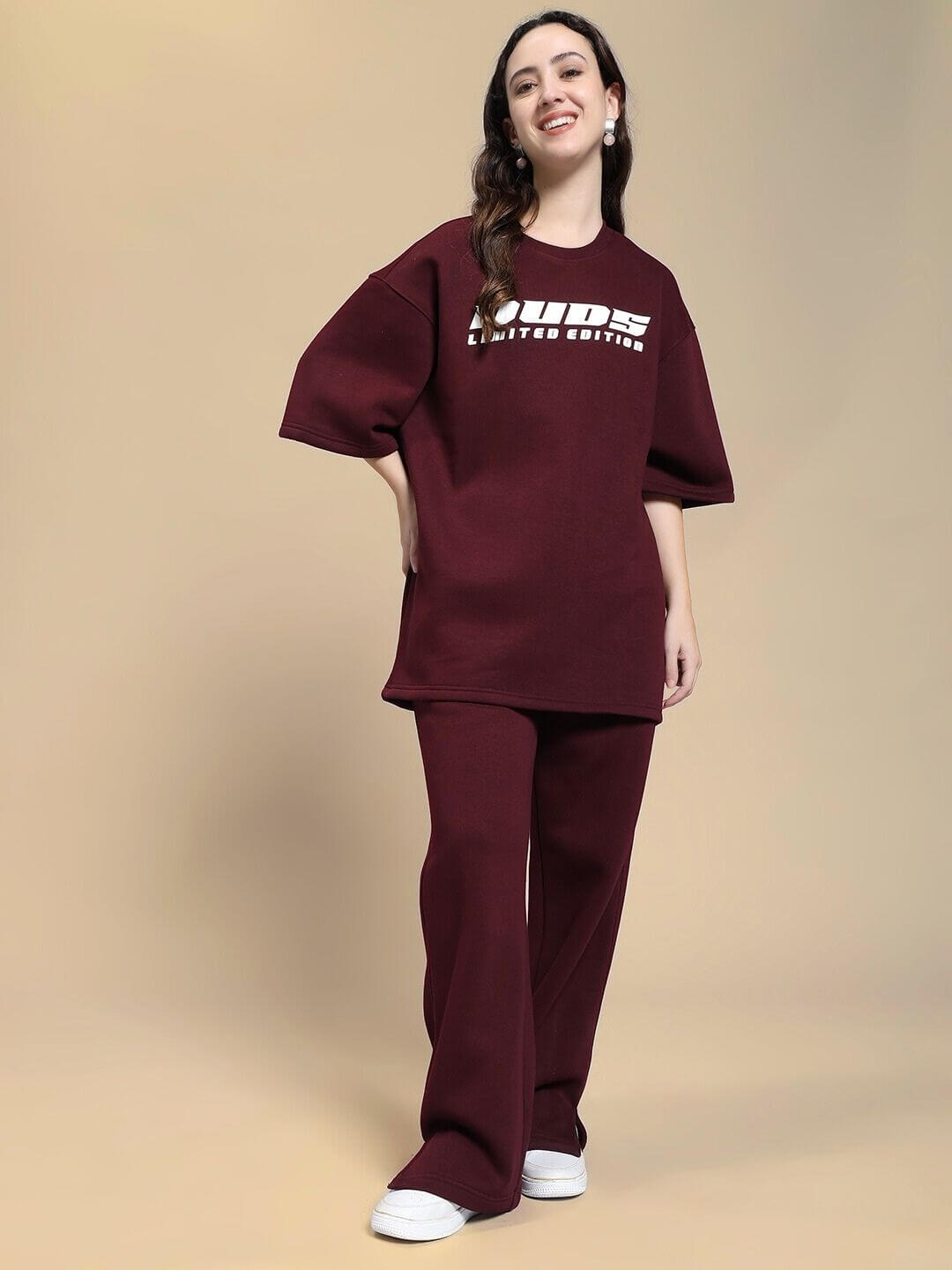 Woman wearing WOMEN SKODA FLEECE CO-ORD SET MAROON, showcasing trendy maroon co-ord outfit for style and comfort.