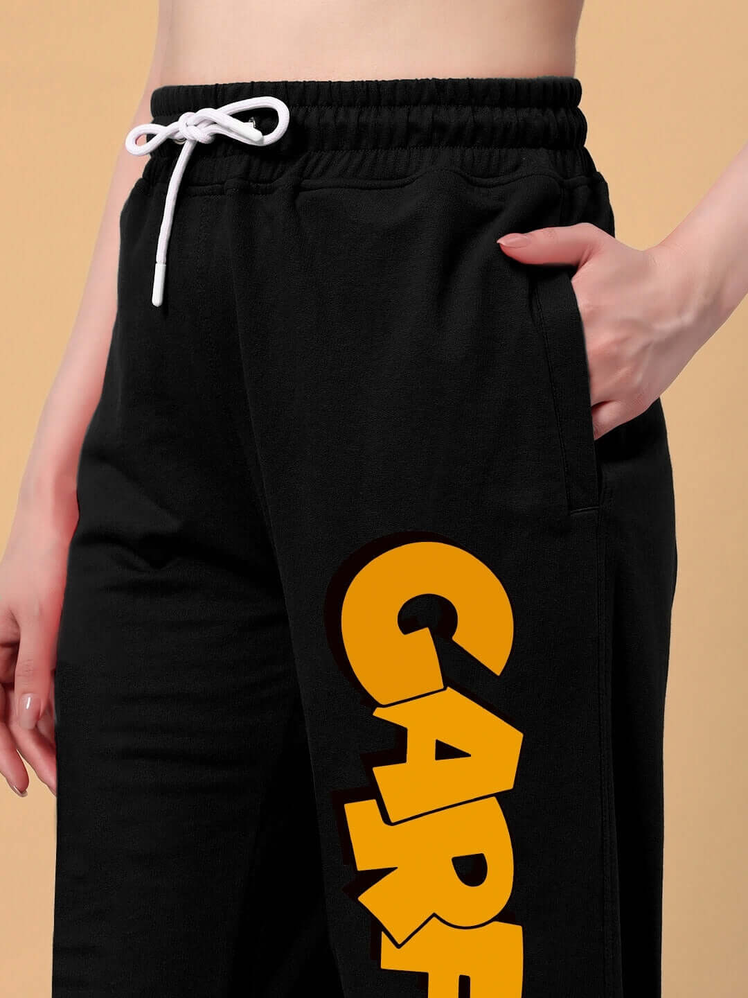Women's Smug Garfield Relaxed Fit Jogger in black with yellow lettering, featuring a white drawstring and comfortable design.