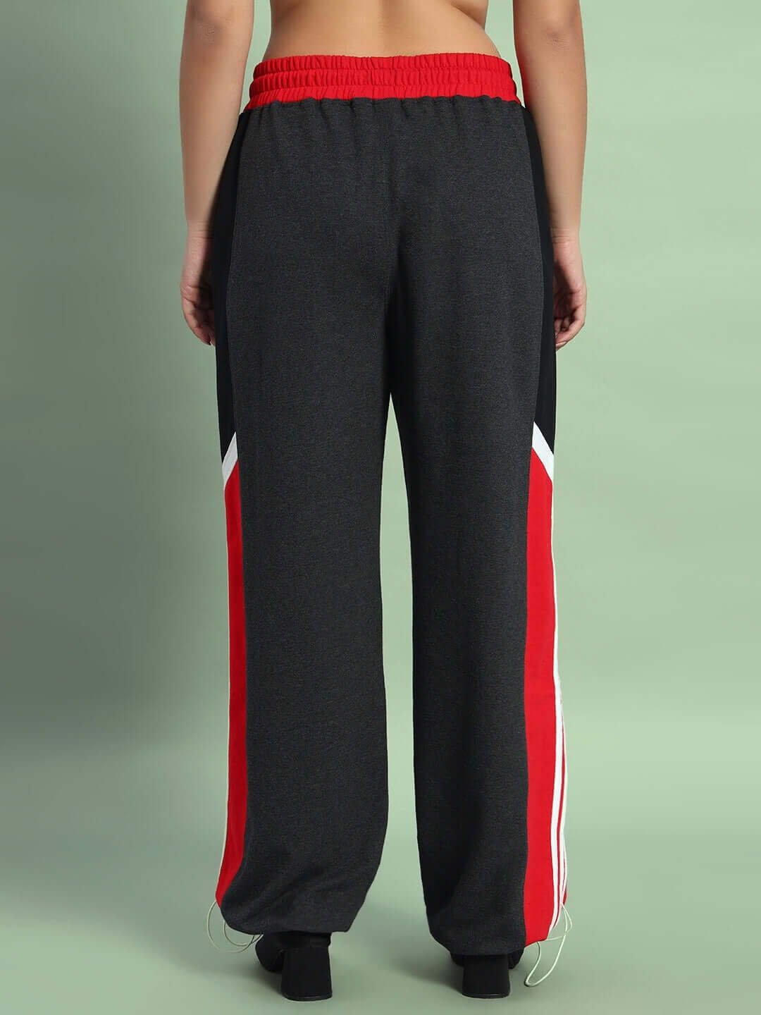 Back view of Women's Snicker Relaxed-Fit Joggers in dark grey and red, elastic waistband, stylish design suitable for casual and active wear.