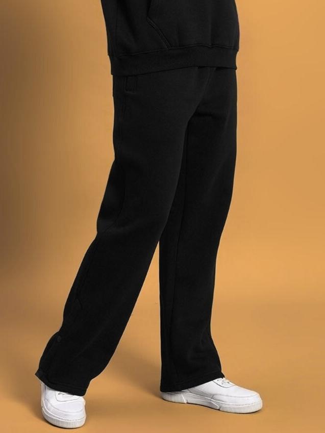 Model wearing WOMEN'S SOOTY FLEECE CARGO PANT BLACK, comfortable and stylish, available for custom fit.