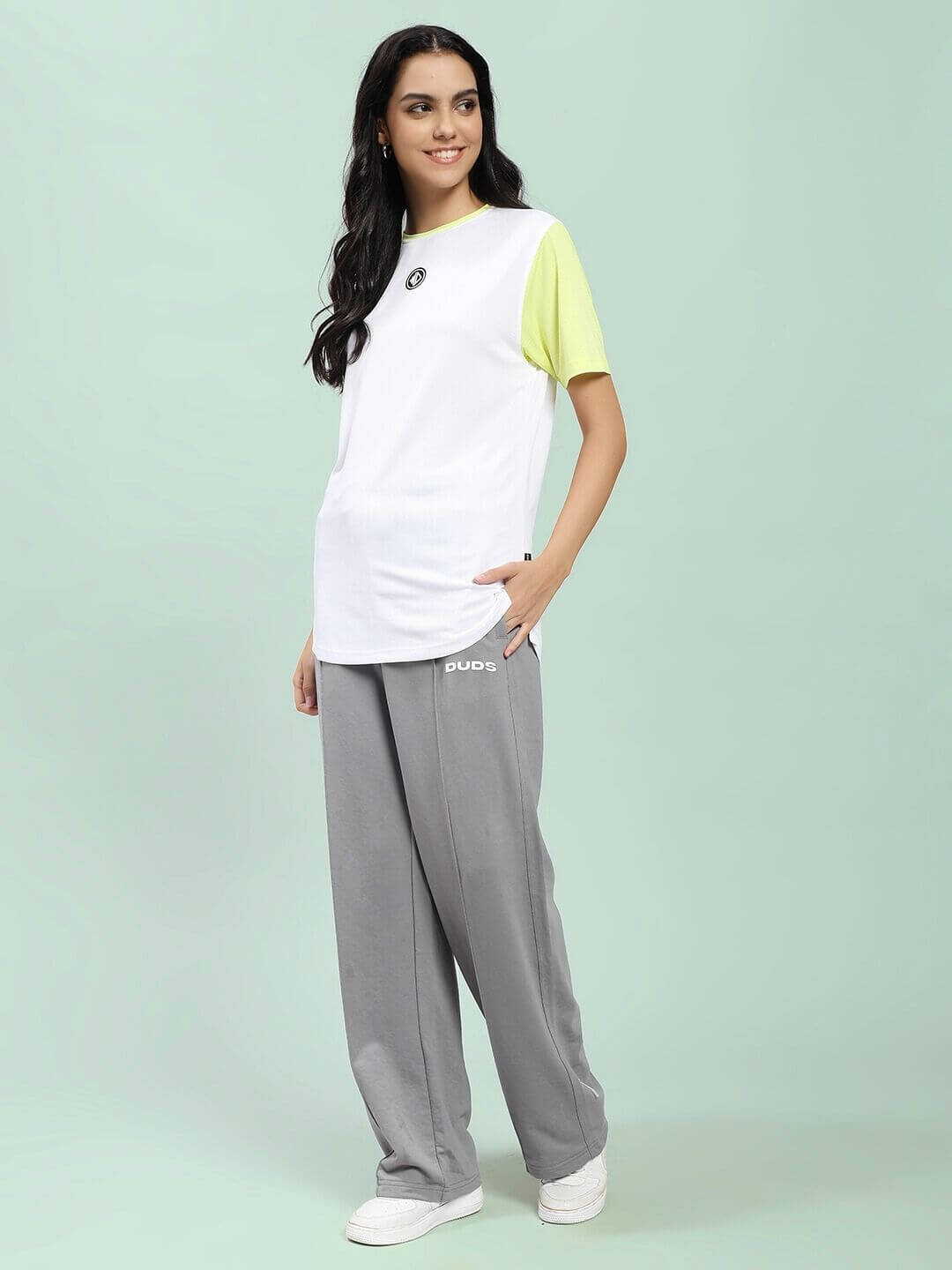 Woman wearing WOMEN SPIRAL RELAXED-FIT JOGGERS GREY for style and comfort, perfect for lounging or street-ready looks.