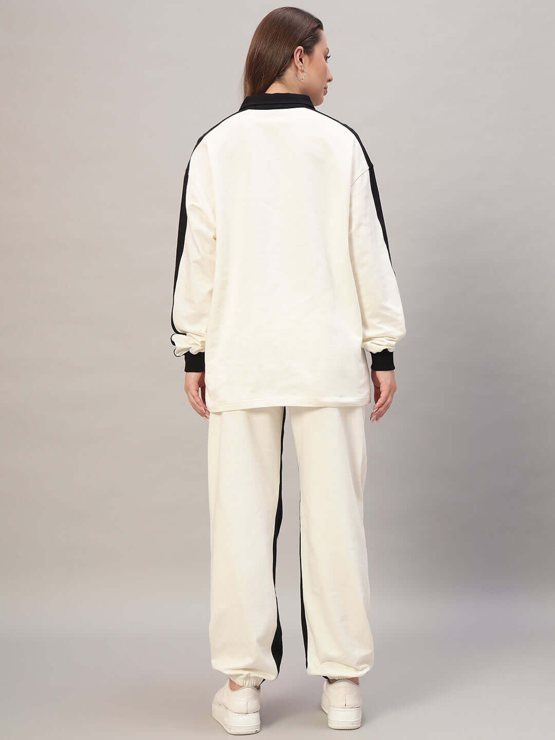 Back view of WOMEN SPLINTER OVERSIZED CO-ORD SET OFF WHITE BLACK showing oversized sweater and joggers with contrast details.