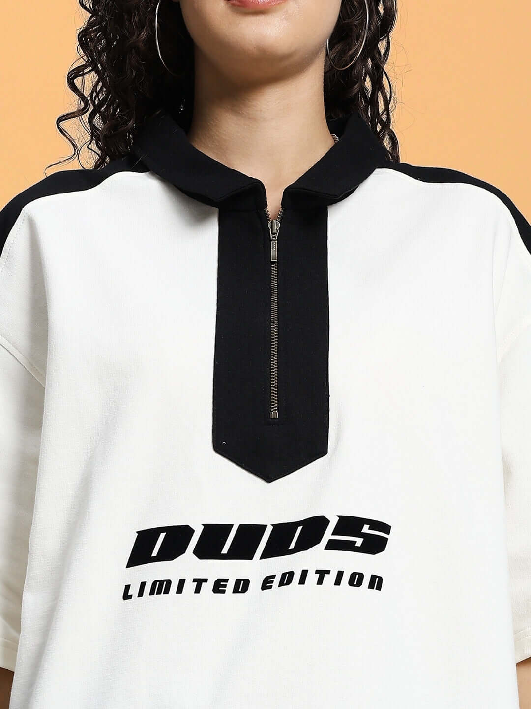 Close-up of Women's Off White Splinter Summer Co-Ord Set with black zip detail, featuring "Duds Limited Edition" text.