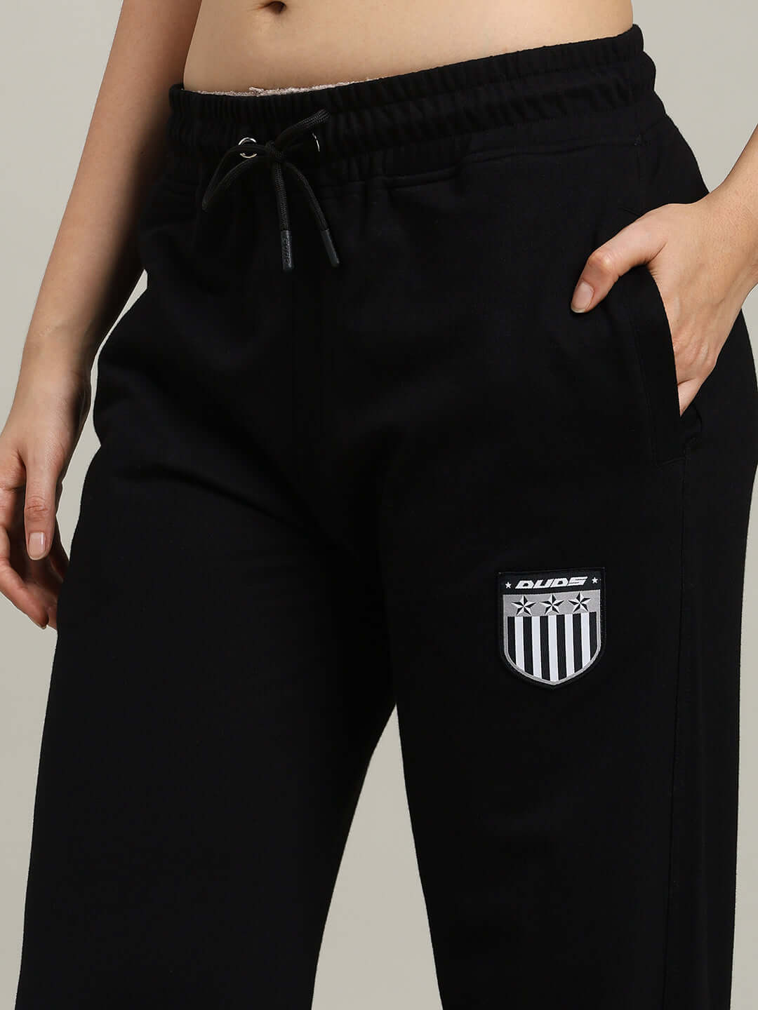 WOMEN'S STUNNER RELAXED FIT JOGGER BLACK with logo patch, elastic waistband, black color, tailored design by DUDS.