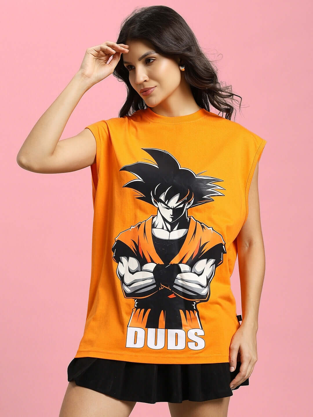 Woman wearing orange Super Saiyan gym t-shirt with bold graphic and 'DUDS' logo, ideal for custom fit orders.