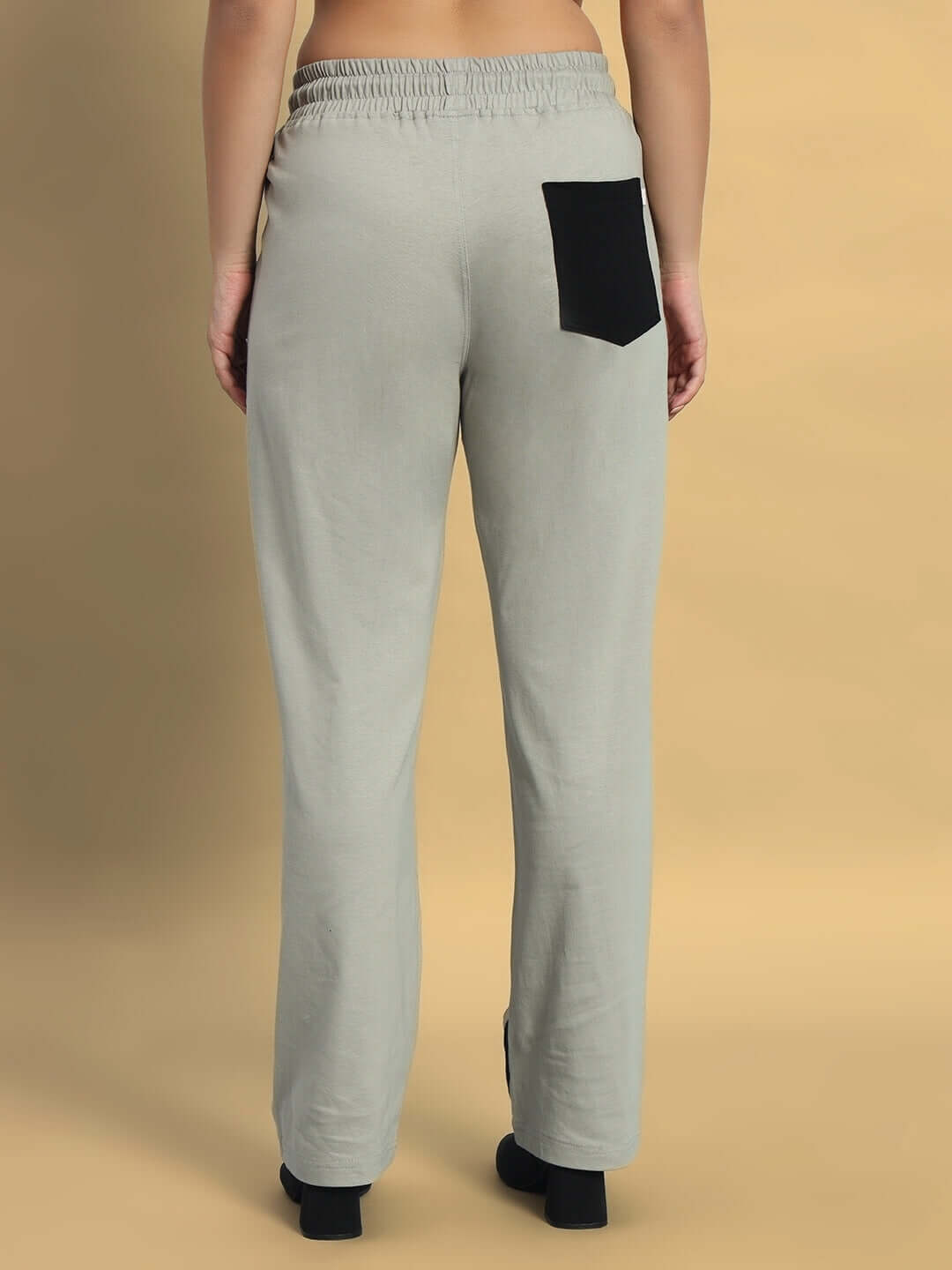 Back view of women's grey surfing jogger with black pocket, showcasing comfortable fit and design.