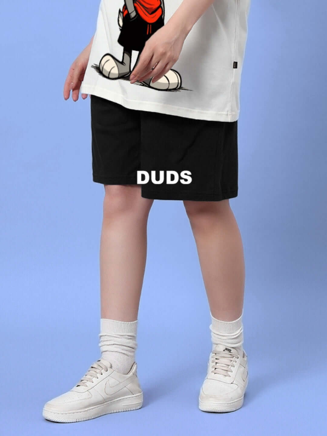 Model wearing women's 'Think Big' summer shorts in black by DUDS, showcasing the casual and comfortable fit.