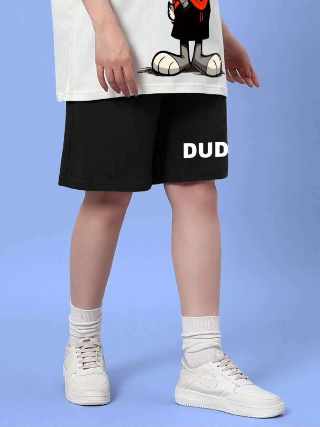 Model wearing Women's Think Big Summer Shorts in black by DUDS, showcasing casual summer style and customizable fit options.
