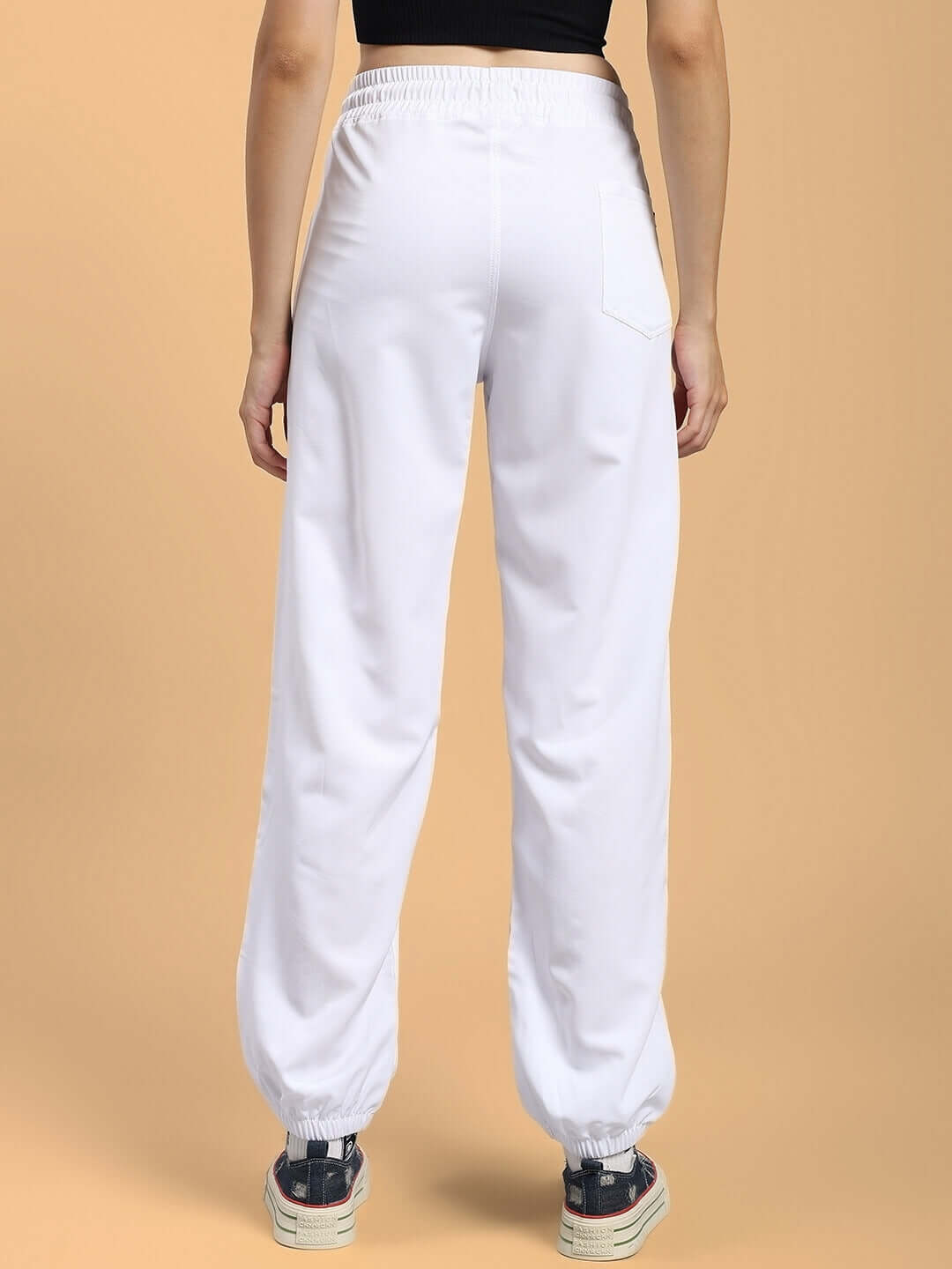 Back view of WOMENS TOKYO RELAXED FIT JOGGERS WHITE featuring elastic waistband and ankle cuffs.