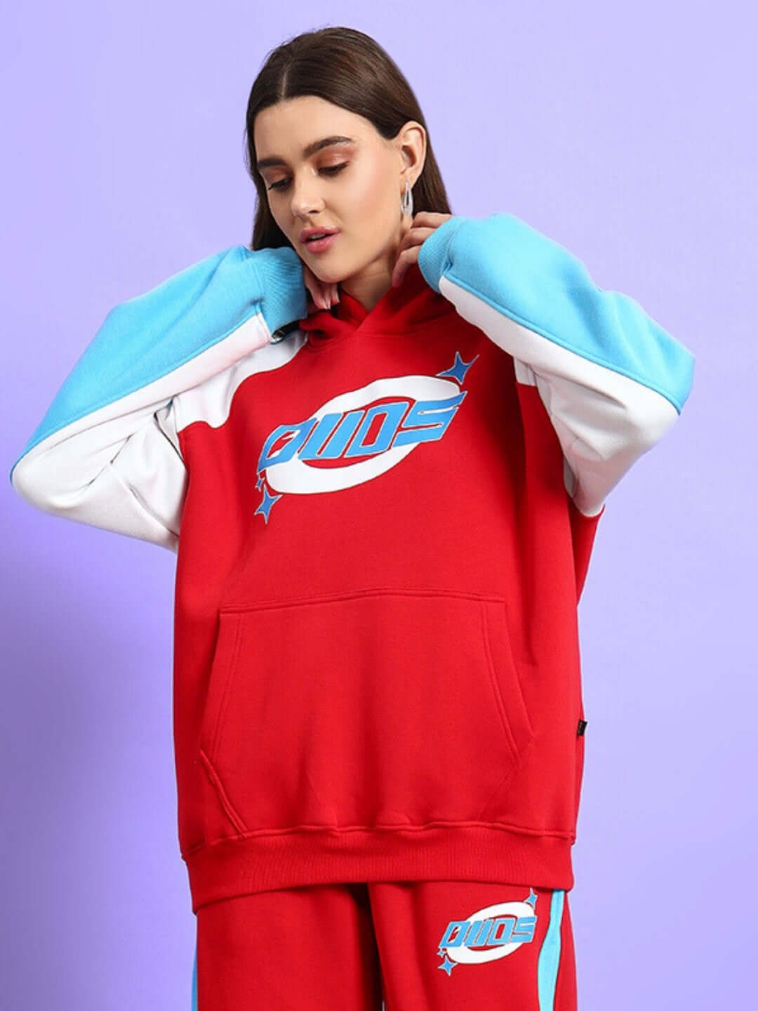 Woman wearing WOMEN TRUNKIT FLEECE COLORBLOCK HOODIE RED with colorblock design