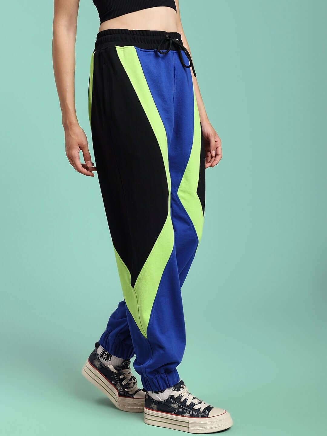 Model wearing WOMENS ULTRA COLORBLOCK RELAXED-FIT JOGGERS BLUE-BLACK with bold design and comfortable fit.