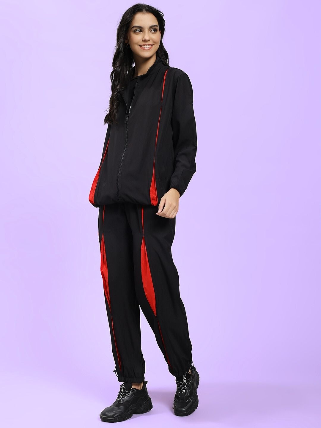 Model wearing WOMEN UNISON RELAXED FIT CO-ORD SET BLACK RED for fashion and comfort.