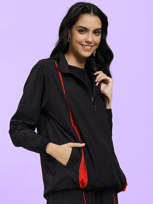Model wearing WOMEN UNISON RELAXED FIT JACKET BLACK RED showcasing effortless street-style and comfort.