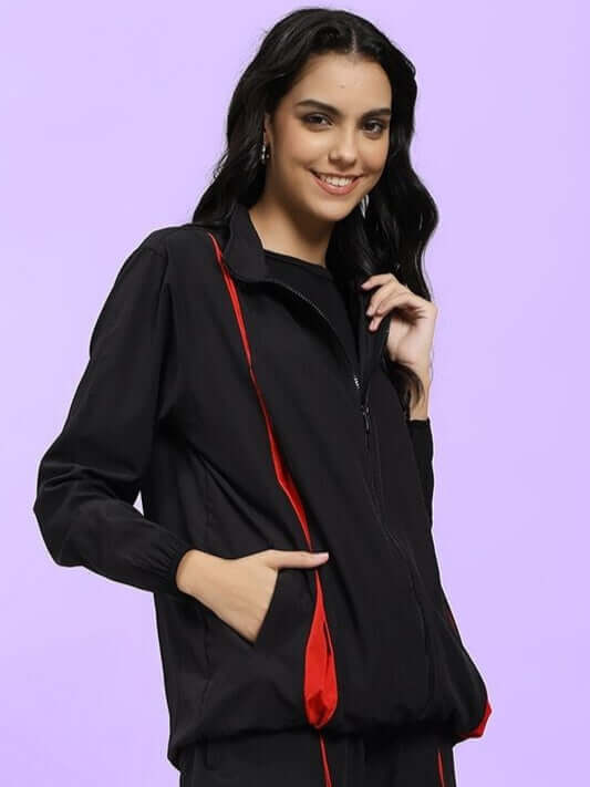 Model wearing WOMEN UNISON RELAXED FIT JACKET BLACK RED showcasing effortless street-style and comfort.