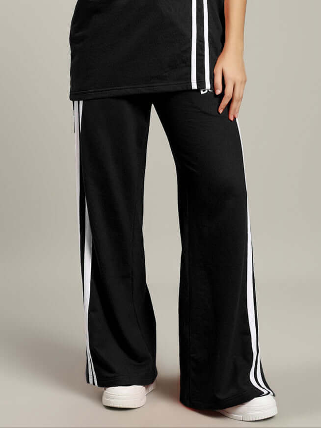 Women's United Stripe Joggers in black with white stripes, tailored fit, offering customizable options for a personalized style.