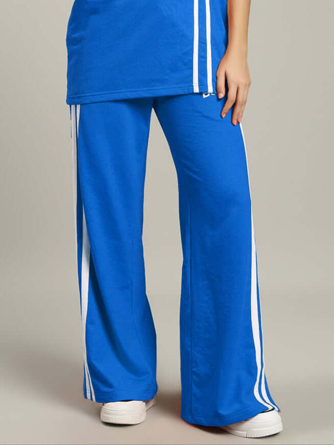 Women's United Stripe Joggers in Blue featuring white stripes, showcasing style and comfort. Available for custom fit.