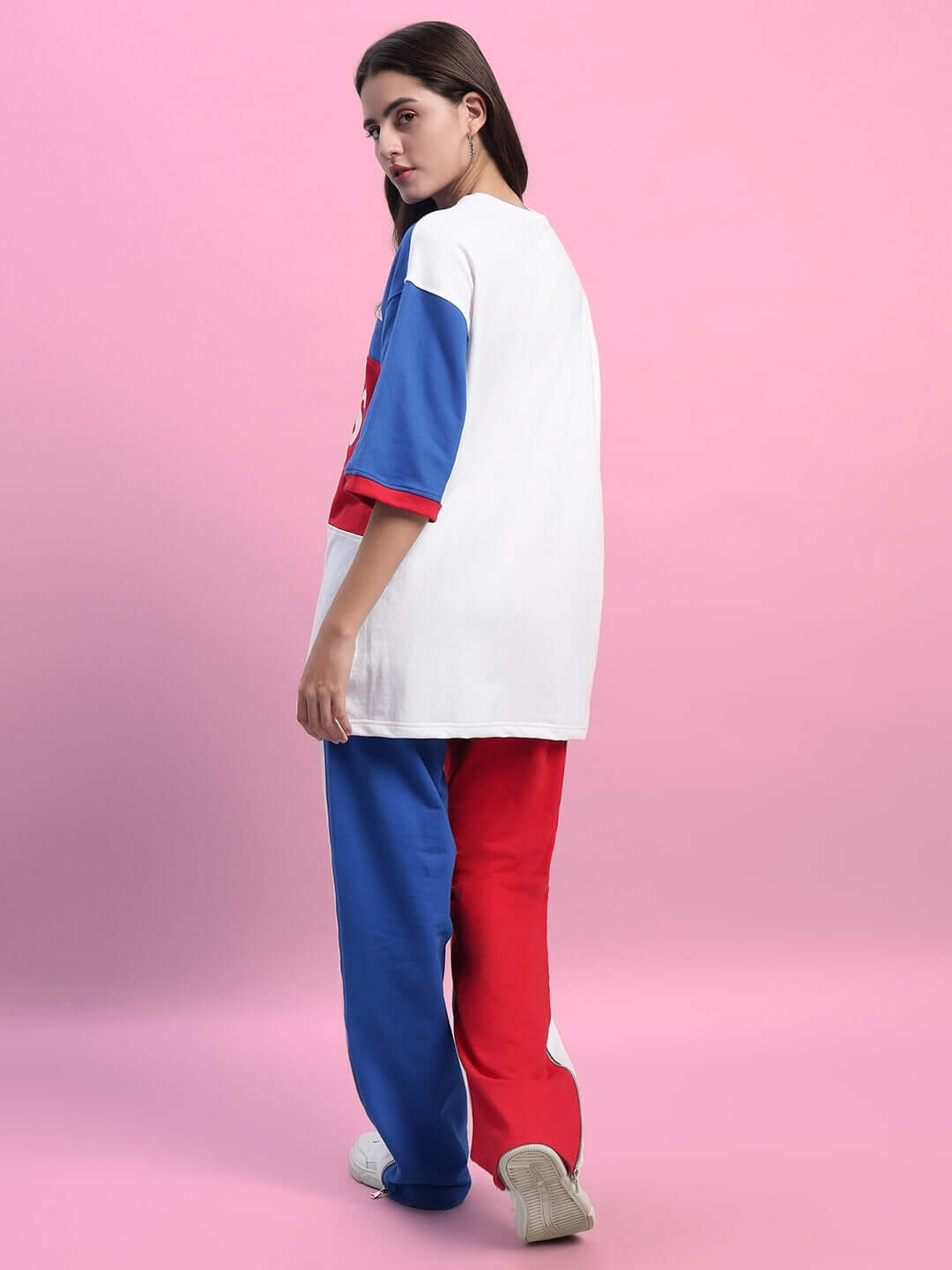Woman wearing WOMEN'S URBAN DRIFT CO-ORD SET MULTI outfit, featuring oversized top and color block pants.