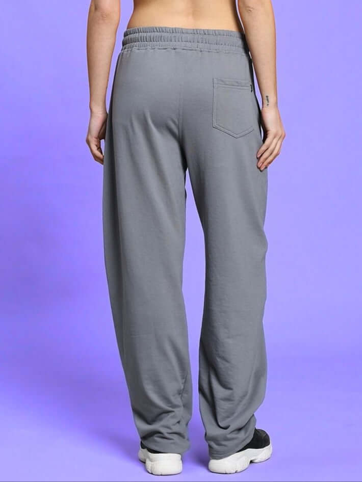 Back view of women's vanilla relaxed-fit grey joggers made by DUDS, showcasing comfortable fit and pocket detail.