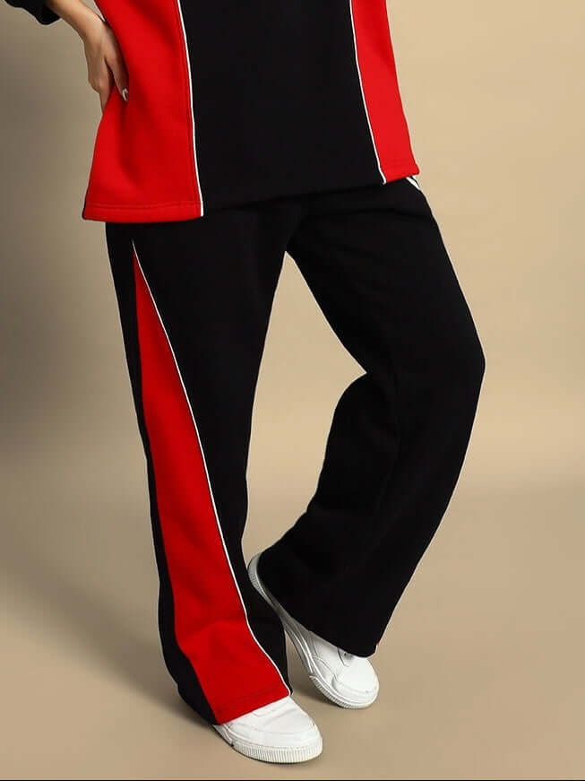 Black and red women's Fireball colorblock cargo pants with white sneakers, perfect for casual sporty looks.