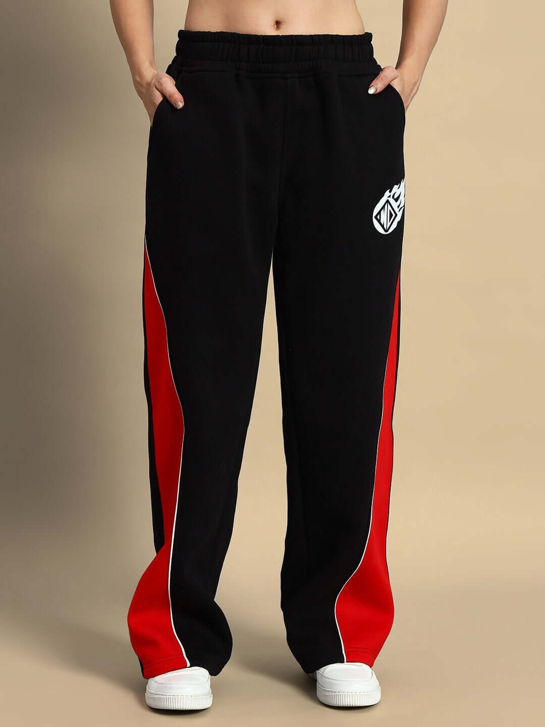 Women's black and red colorblock cargo pants with white sneakers, featuring a comfortable design and WD Fireball logo.
