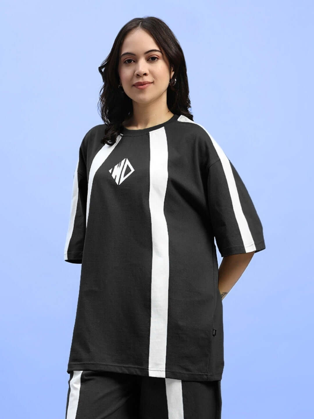 Model wearing black and white women's oversized t-shirt with WND logo, crafted from premium cotton fabric by Color By Colours.