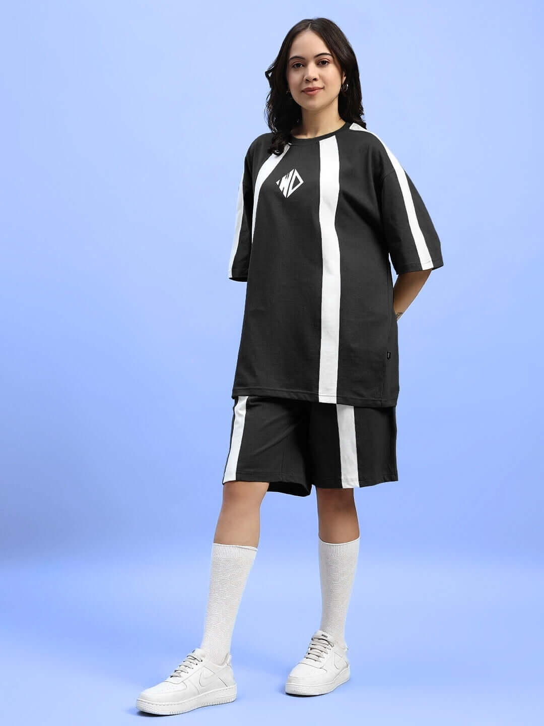 Model wearing Womens Wideline Summer Co-Ord Set Black, featuring a relaxed fit made of lightweight premium cotton fabric for warm-weather comfort.