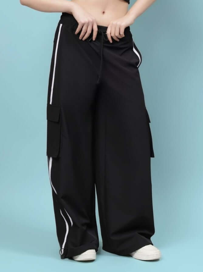 Women's black relaxed fit cargo pants with multi-pocket design, customizable size option, shown against a blue background.