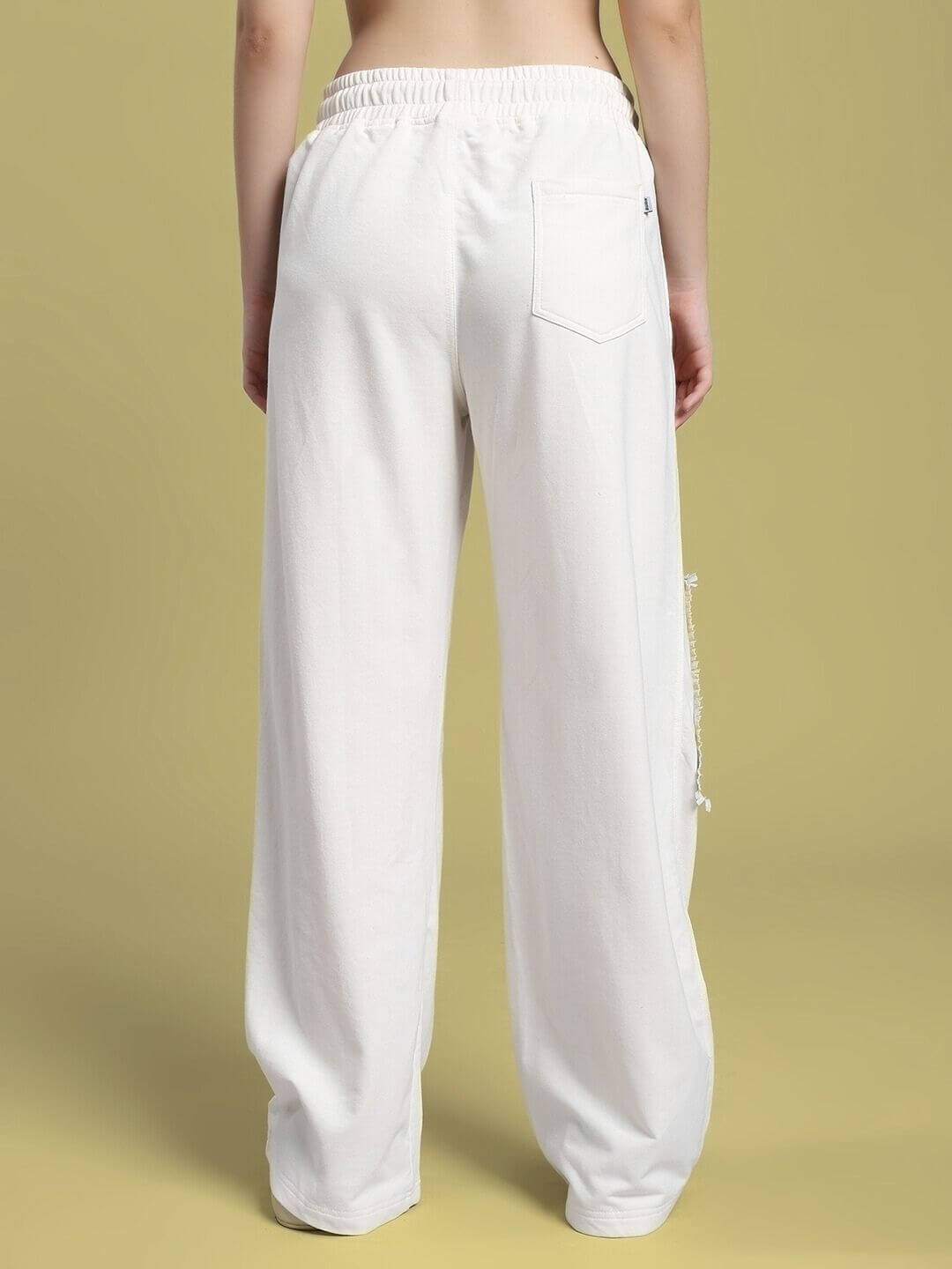 Back view of WOMEN'S YARA GEOMETRIC PRINT CO-ORD SET OFF-WHITE, showing relaxed fit pants made of lightweight, breathable fabric.