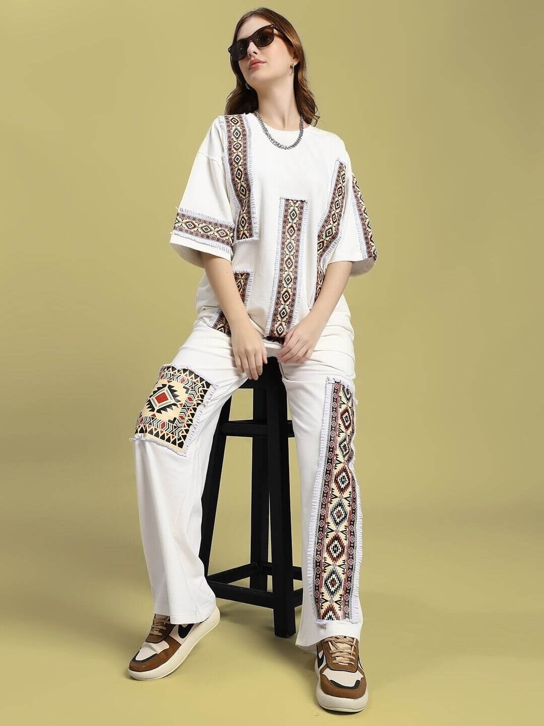 Model wearing WOMEN'S YARA GEOMETRIC PRINT CO-ORD SET OFF-WHITE, stylish two-piece with chic geometric print, ideal for casual outings.