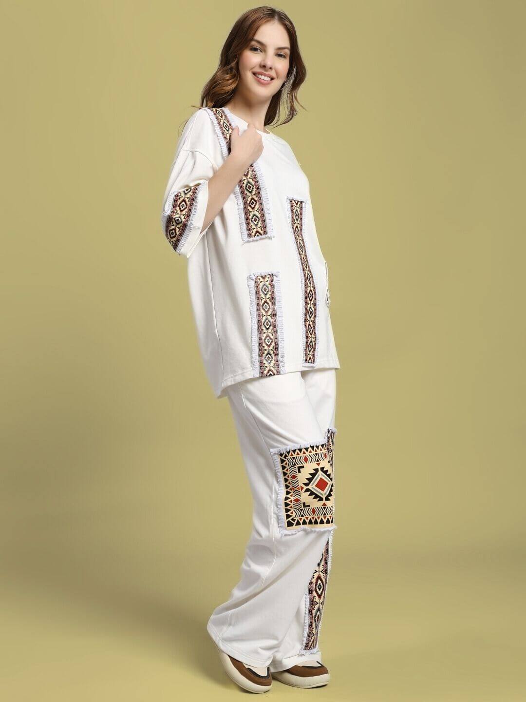 Model wearing WOMEN'S YARA GEOMETRIC PRINT CO-ORD SET OFF-WHITE with chic geometric print; ideal for casual outings.
