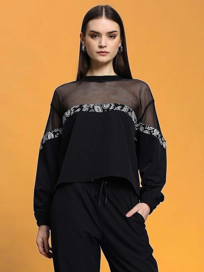 Model wearing Women's Yesmin Relaxed Fit Top Black, showing its elegant design and comfortable fit.