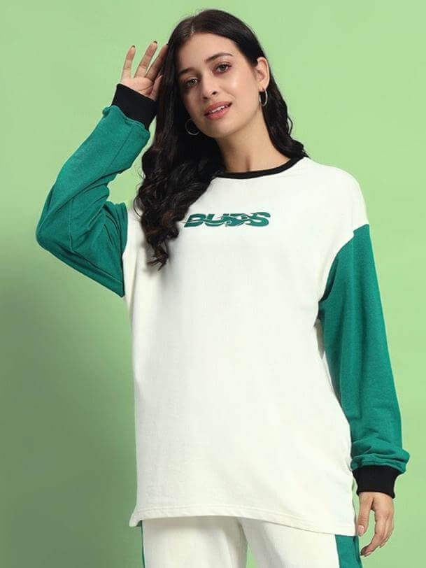 Model wearing WOMEN'S ZINGY OVERSIZED SWEATSHIRT OFF WHITE TEAL made from premium cotton terry and elastane, front view.
