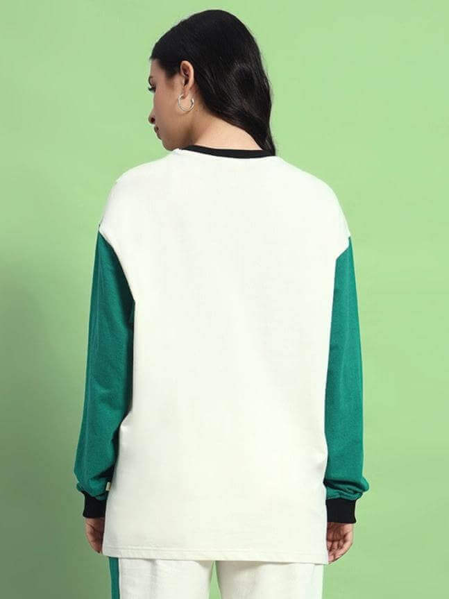Back view of model wearing WOMEN'S ZINGY OVERSIZED SWEATSHIRT OFF WHITE TEAL, showcasing premium fabric and stylish design.